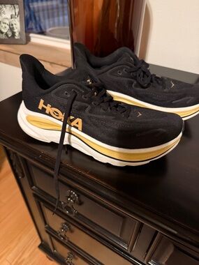 Hoka Black and Gold Cushioned Running shoes